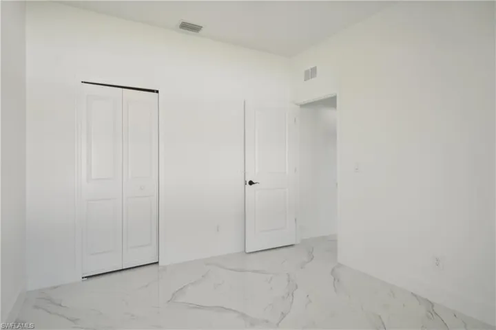 Unfurnished bedroom with a closet