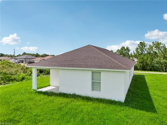 View of home's exterior featuring a lawn