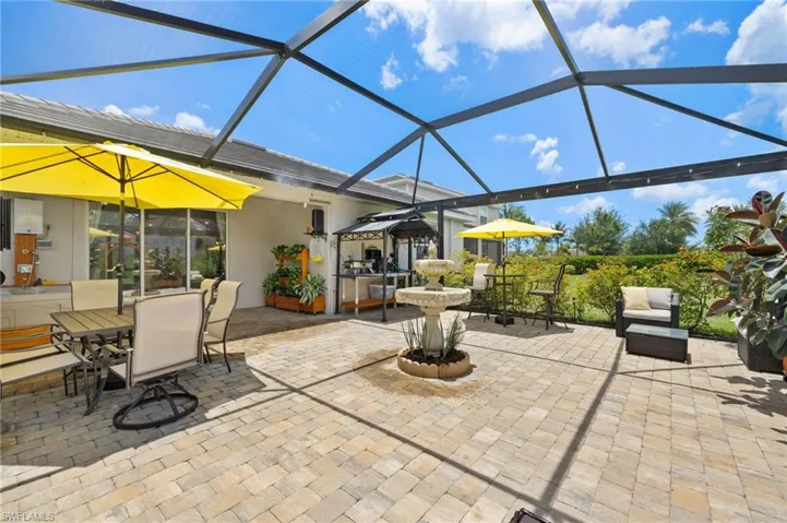 View of patio featuring a lanai and outdoor dining area