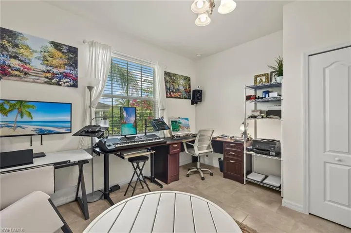 Office area featuring baseboards and light tile patterned floors