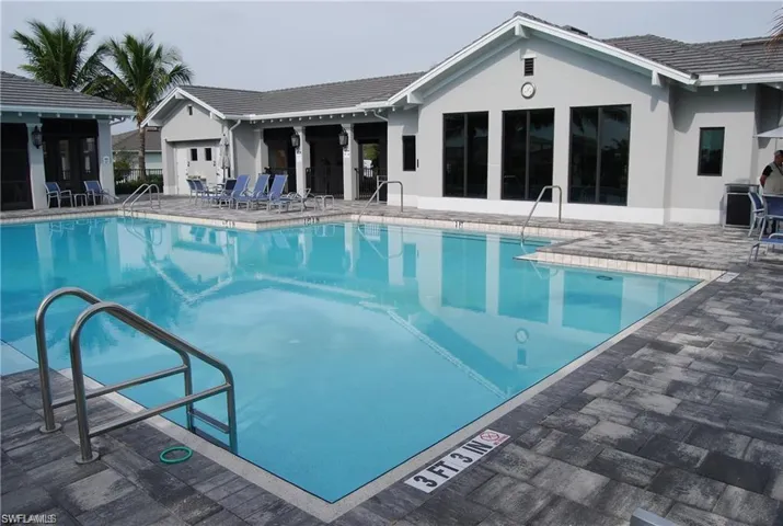 Community pool featuring a patio area