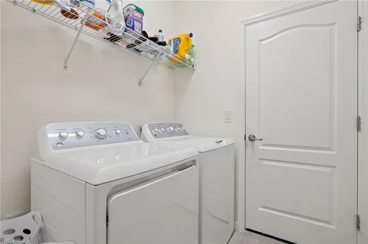 Laundry room featuring washing machine and clothes dryer