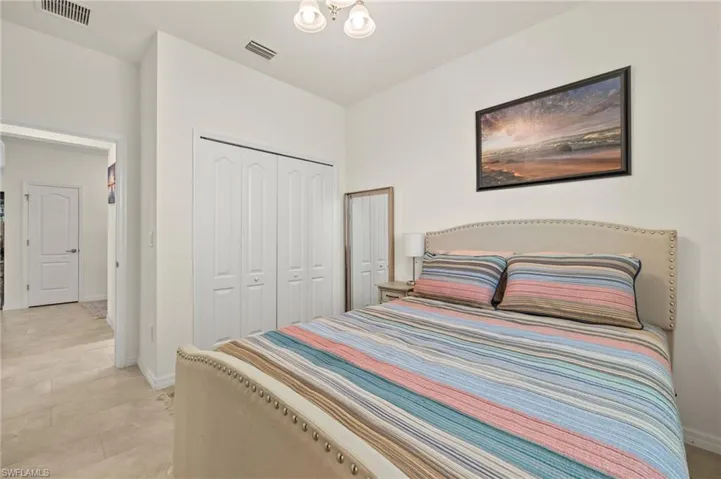 Bedroom featuring a closet and baseboards