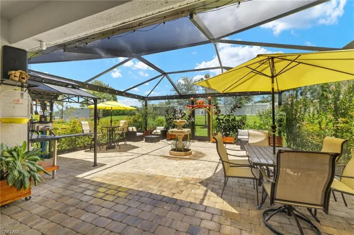 View of patio / terrace featuring glass enclosure and outdoor dining area