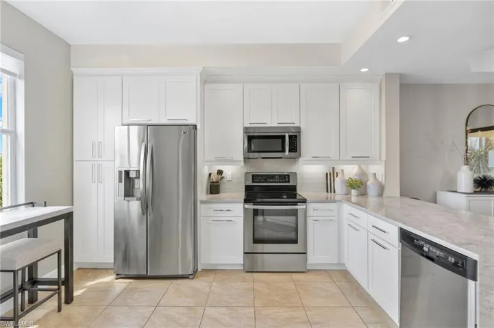 Recently remodeled has pantry, soft close cabinets, premium Pompeii-Bahia Quartz counters & under counter lighting