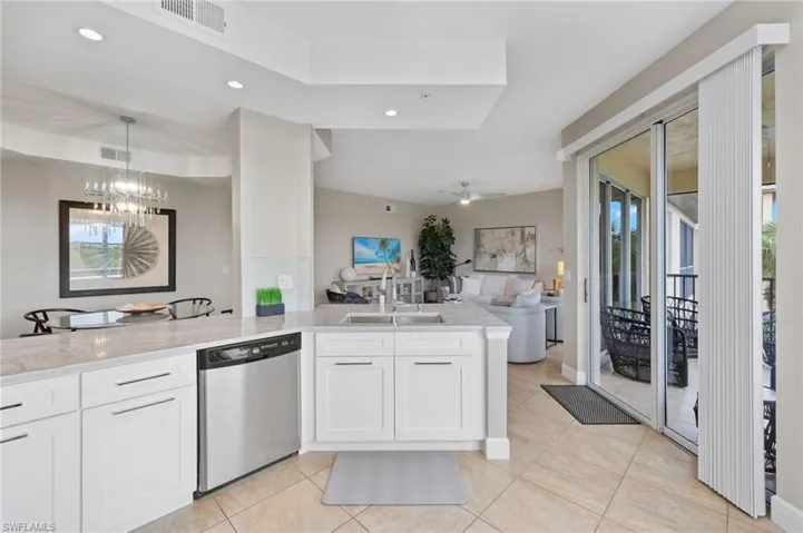 White soft close cabinets and stainless steel appliances.