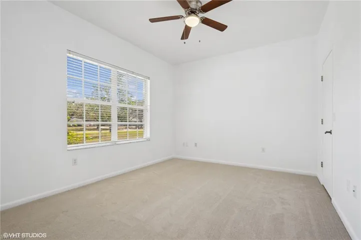 Bedroom #3 - featuring new carpet, ceiling fan, and baseboards