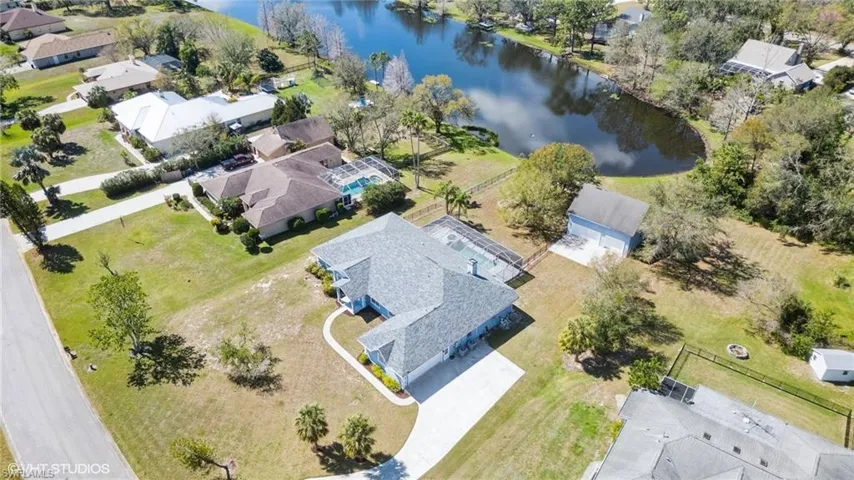 Aerial view featuring a water view and a residential view