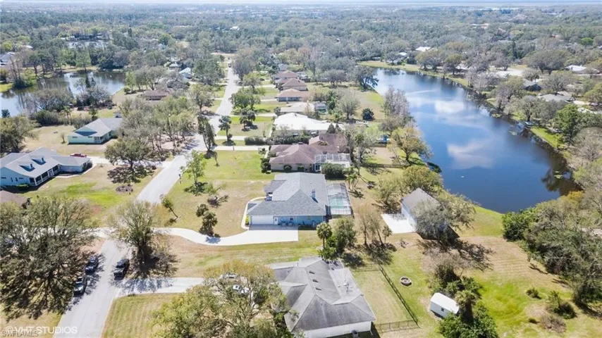 Drone / aerial view featuring a residential view and a water view