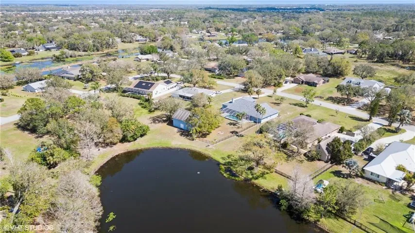 Bird's eye view with a water view and a residential view