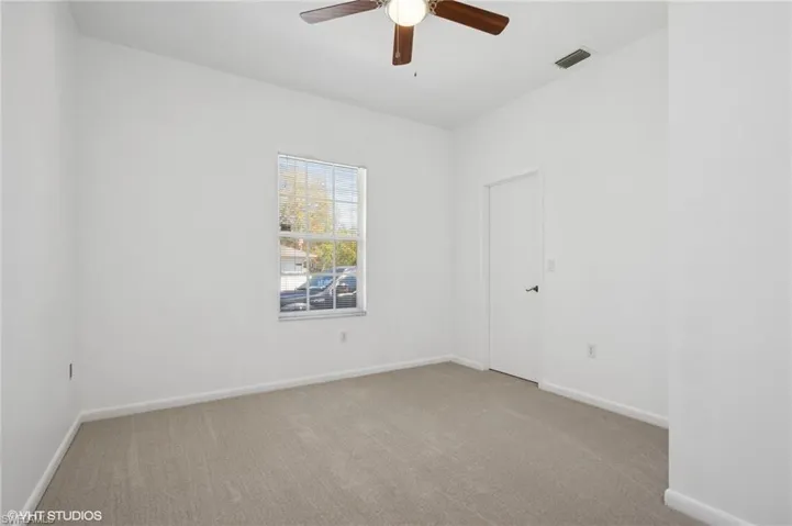 Bedroom #4 with new carpet, baseboards and ceiling fan