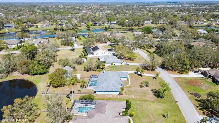 Aerial view featuring a water view and a residential view