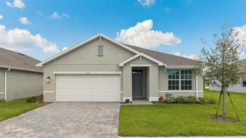 Model home. Single story home with stucco siding, a front lawn, driveway, an attached garage, and a shingled roof