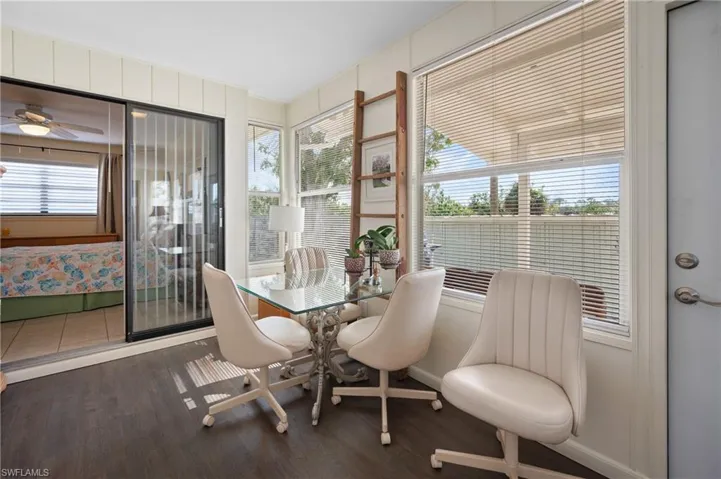 Sunroom featuring wood finished floors