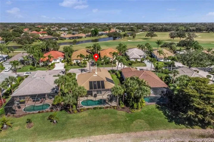 Rear aerial perspective of the home.  Note the solar panels and replaced roof.