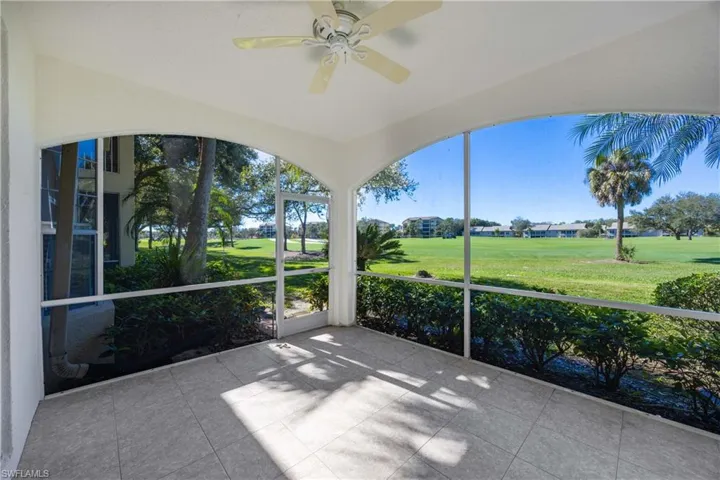 Unfurnished sunroom with ceiling fan and healthy amount of natural light