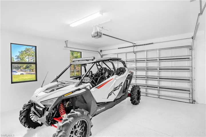 Garage featuring a garage door opener