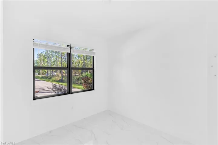 Empty room with light marble finish floors and baseboards