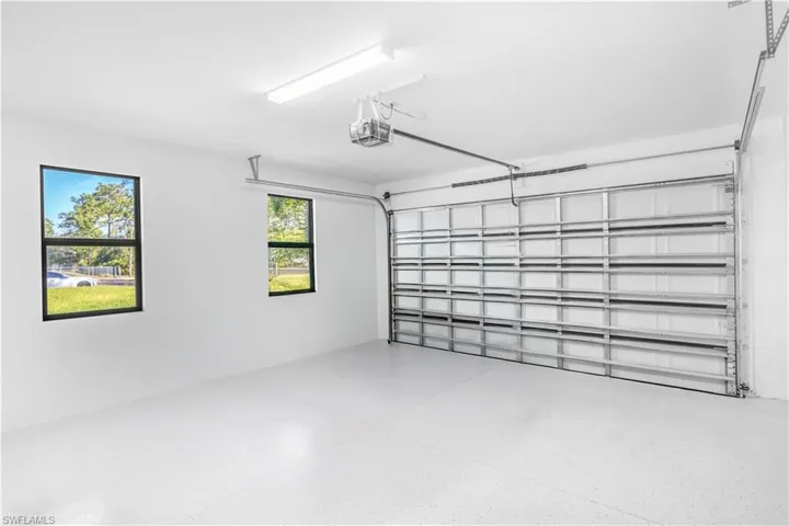 Garage featuring a garage door opener