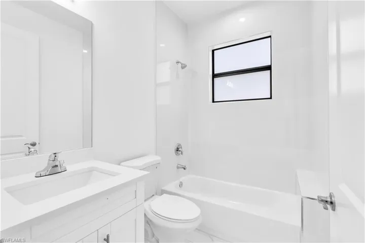 Full bathroom featuring  shower combination and vanity