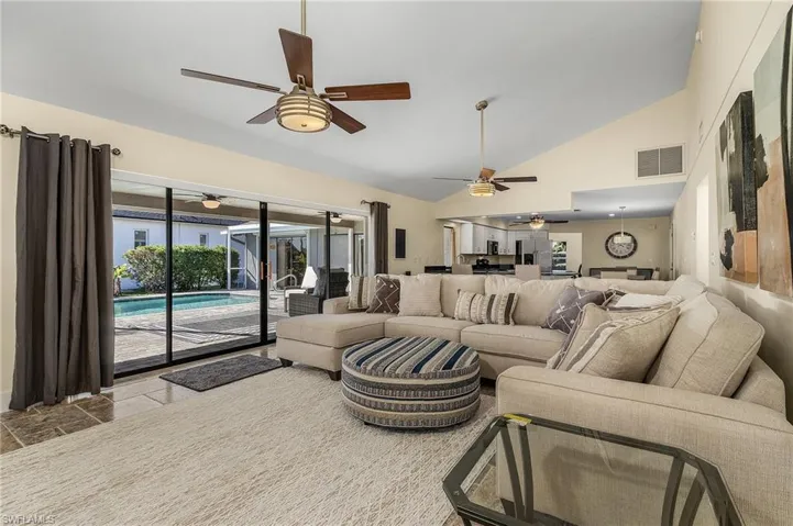 Living room with high vaulted ceiling