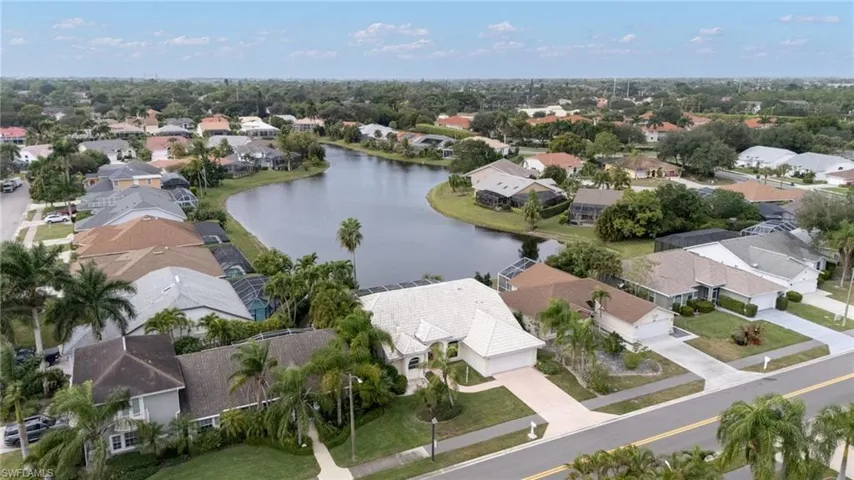 Aerial perspective of suburban area featuring a large body of water