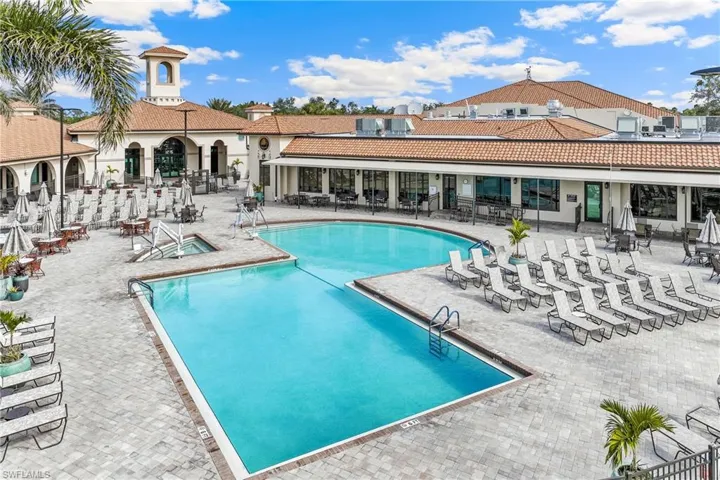 View of community pool with a patio area