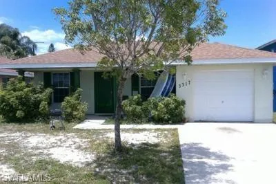 Single story home featuring a garage