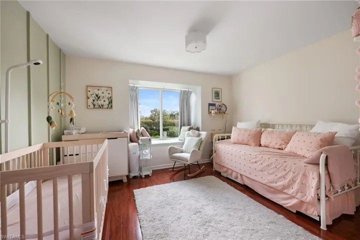 Bedroom featuring dark wood-type flooring