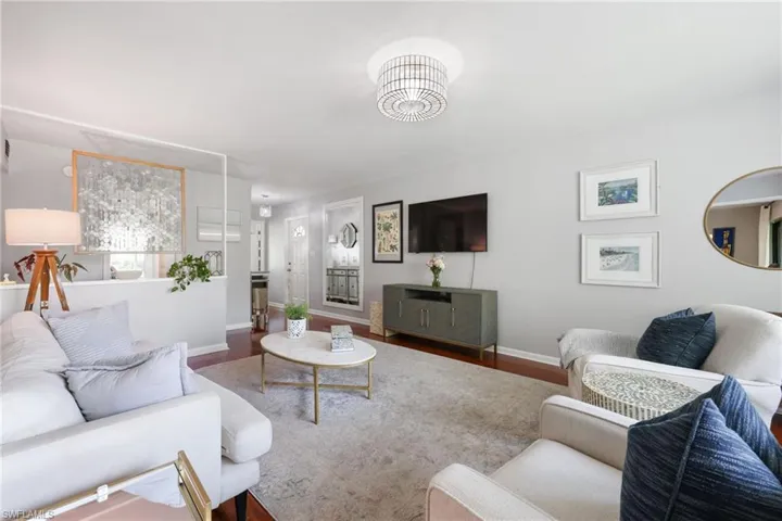 Living room featuring baseboards and wood finished floors