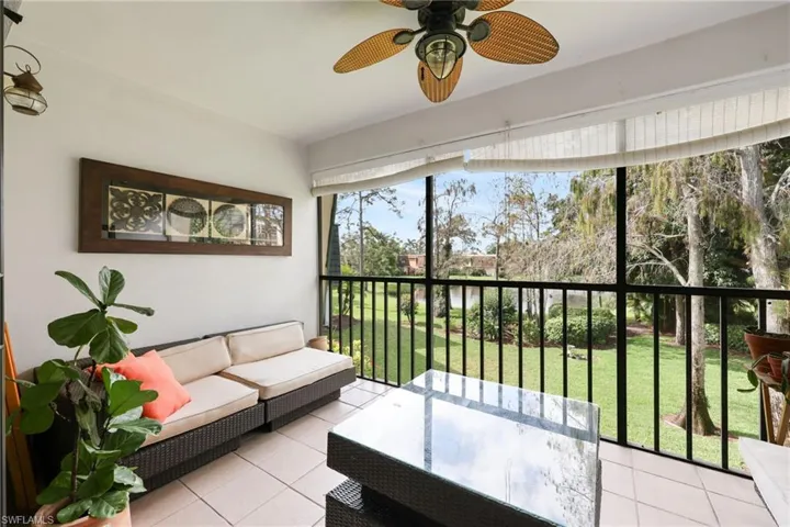 Sunroom / solarium featuring ceiling fan