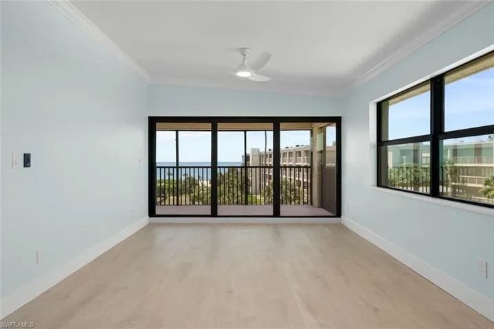 The property features light-toned flooring, light blue walls, and a ceiling fan
