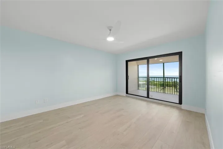 The room features light-colored flooring and light blue walls, complemented by a white ceiling and baseboards