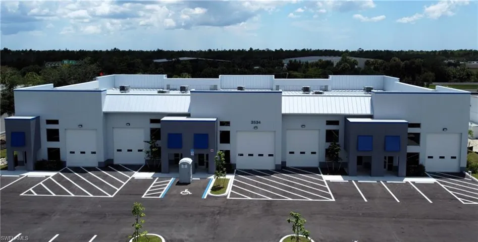 View of building exterior featuring a garage