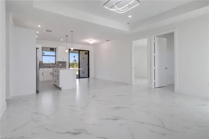 Unfurnished living room with sink