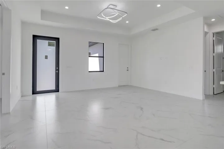 Spare room featuring a raised ceiling