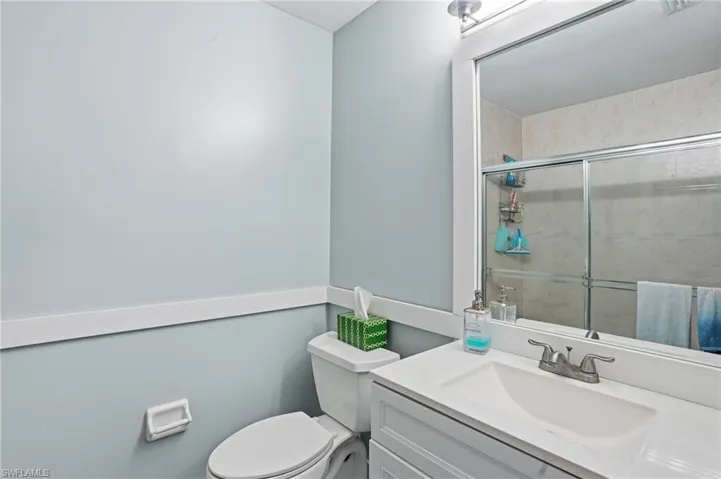 Full bathroom with vanity and tiled shower