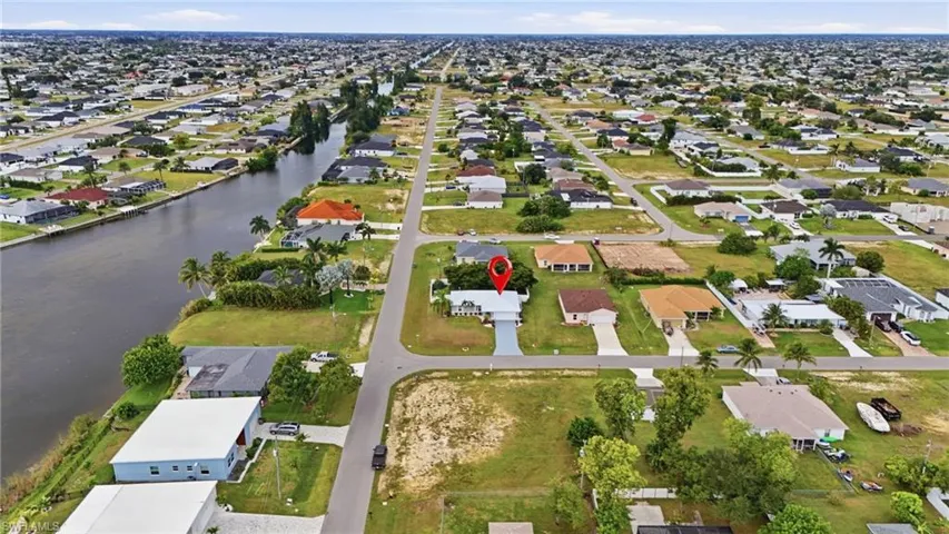 View of property location featuring nearby suburban area and a nearby body of water
