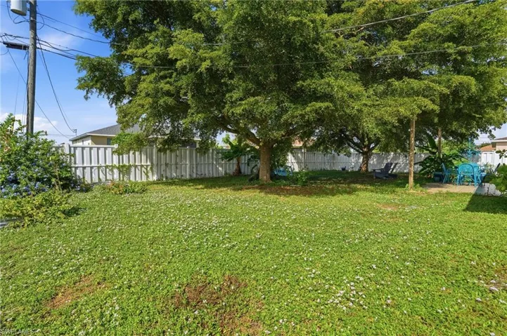 View of fenced backyard