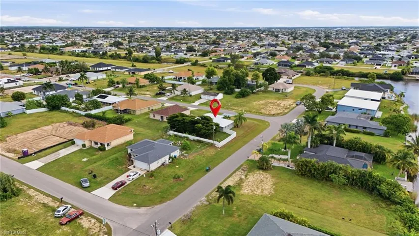 View of property location with nearby suburban area and a large body of water