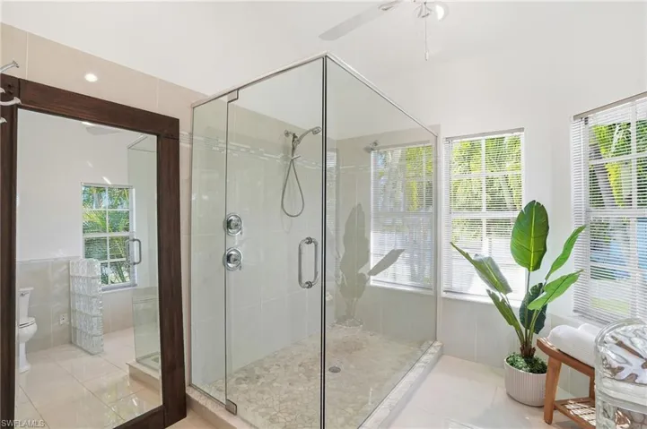 Glass Walk In Shower w/ Multiple Shower heads, Designer Tile, Tile Flooring