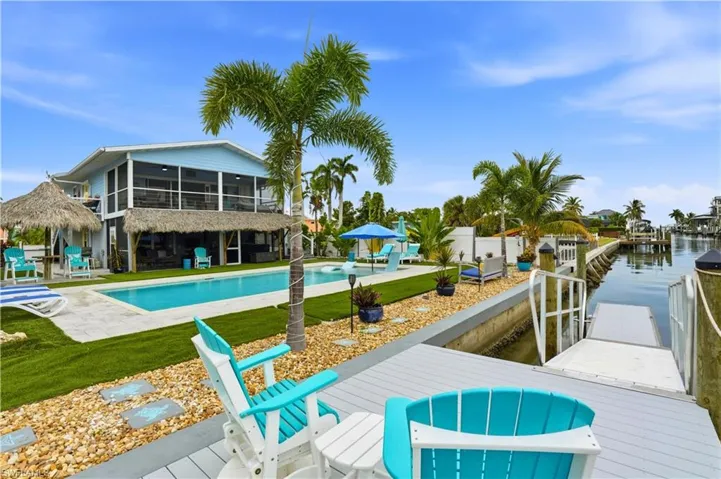 Come live the island life, Tiki Huts, Resort Pool and Gulf Access Canal  (Digitally Edited Image)