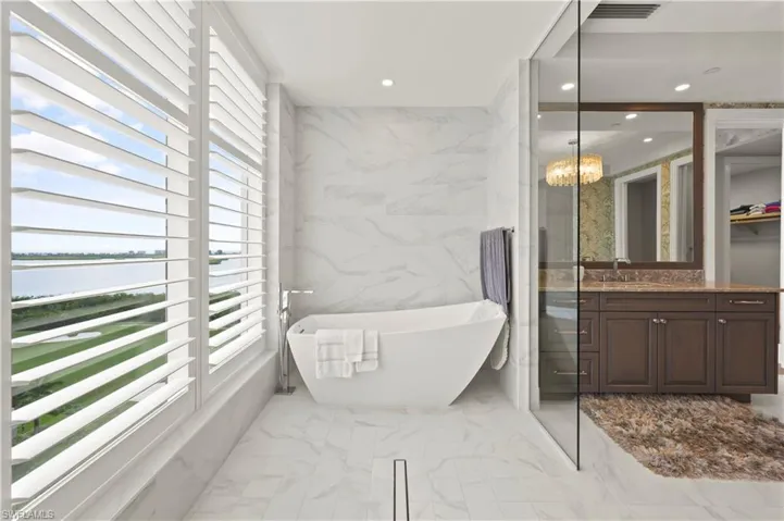 Soaking tub, with shower across from tub.