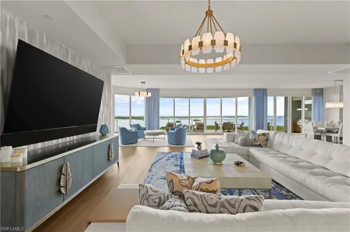 Volume ceilings and an open layout bring the living, dining, and kitchen areas together.