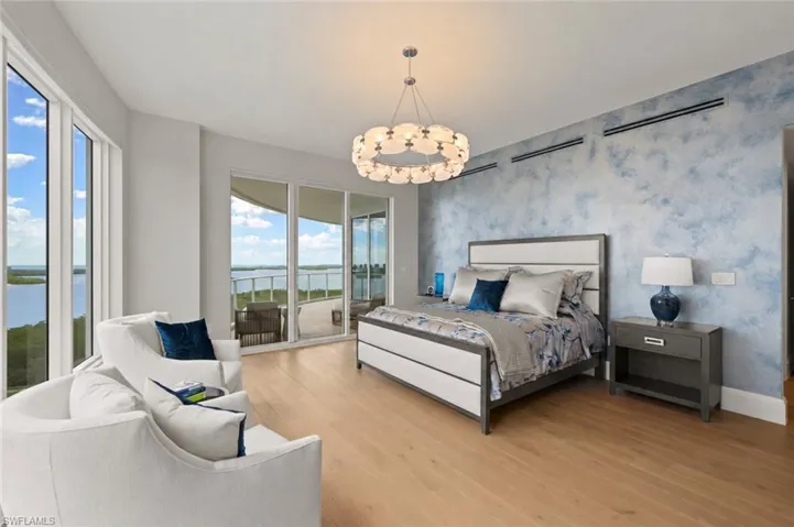 Primary bedroom with ensuite bath, two HUGE walk in closest and lanai access.