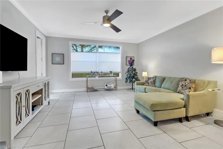 Spacious Living Room with tons of natural lighting and tile flooring throughout first floor