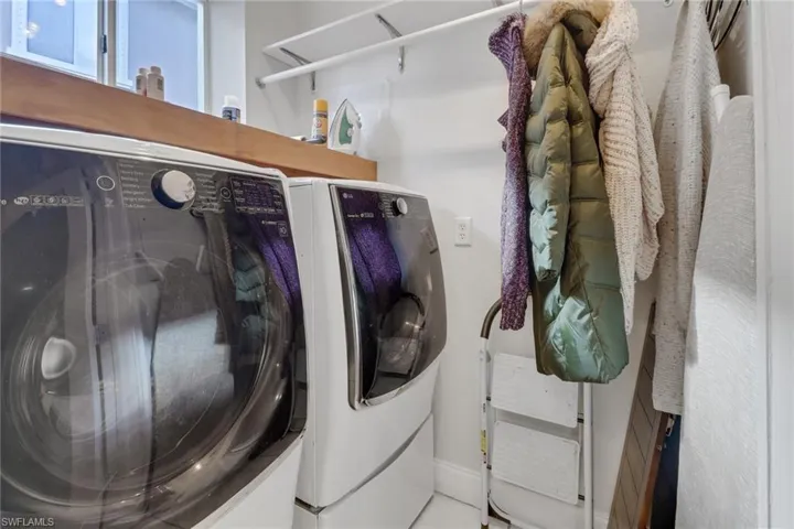 Washer/Dryer with folding area and shelving for added storage