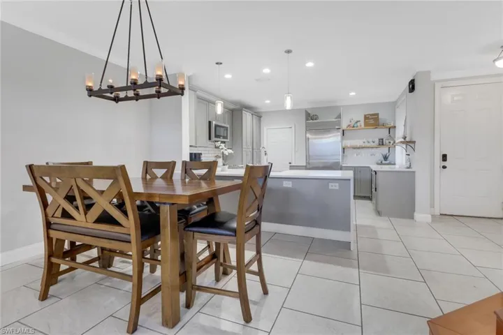 Dining Area off the kitchen with breakfast bar that sits at least 4 people!