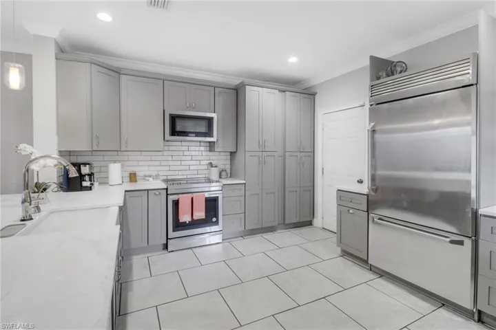 Oversized Quartz Countertops, beautiful cabinets, stainless steel appliances