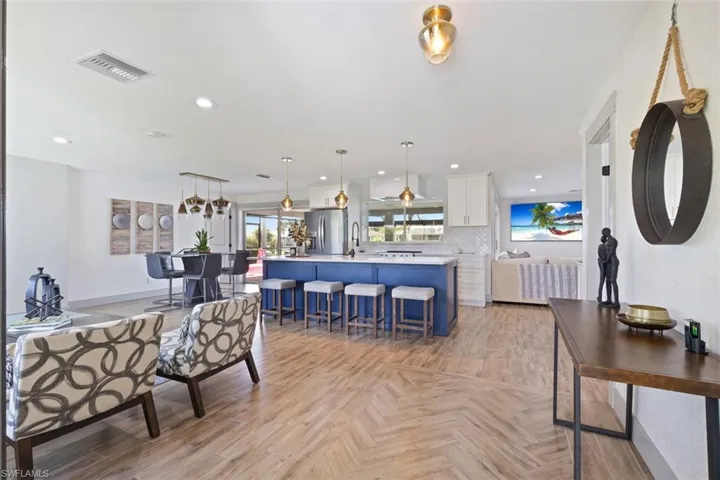 Living area featuring recessed lighting and parquet flooring